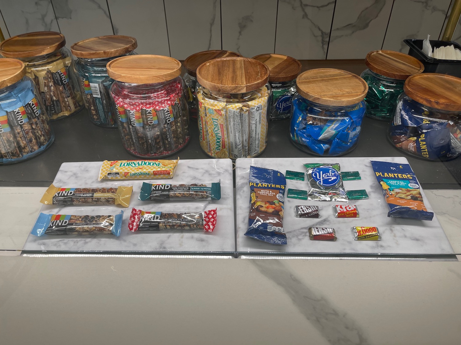 a group of jars of candy and candy bars