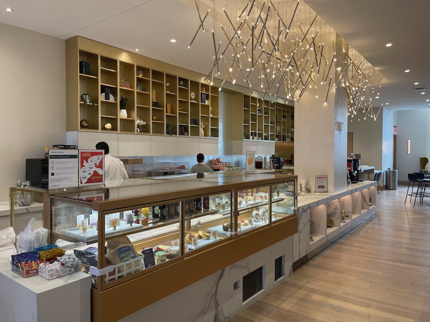 a restaurant with a counter and shelves