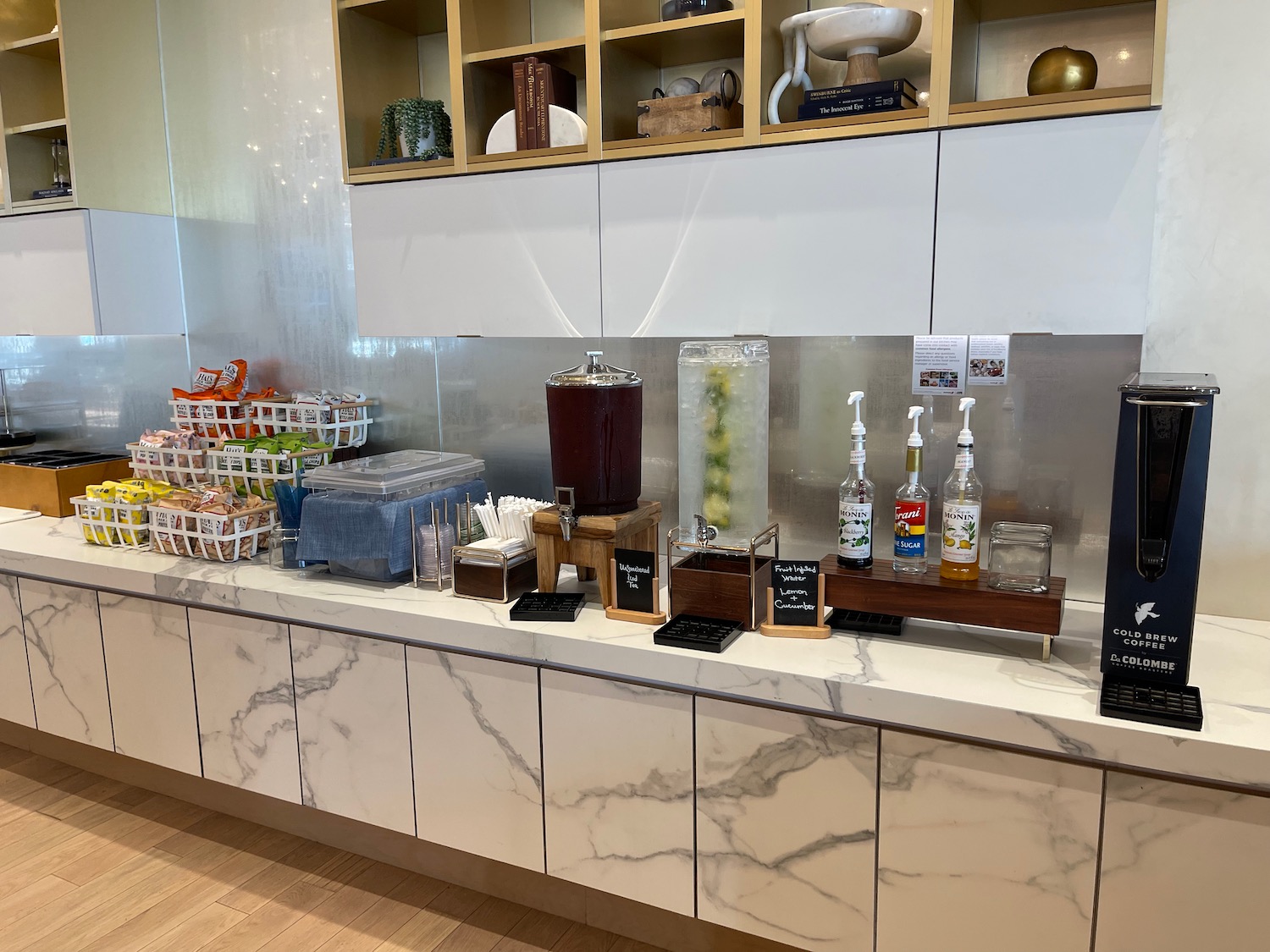 a counter with a variety of drinks and beverages