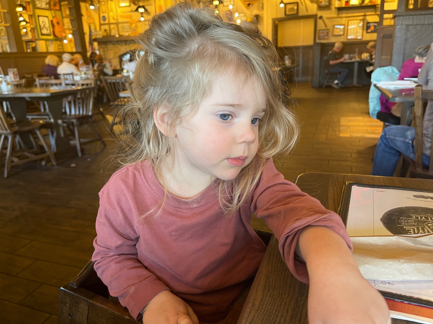 a girl sitting at a table