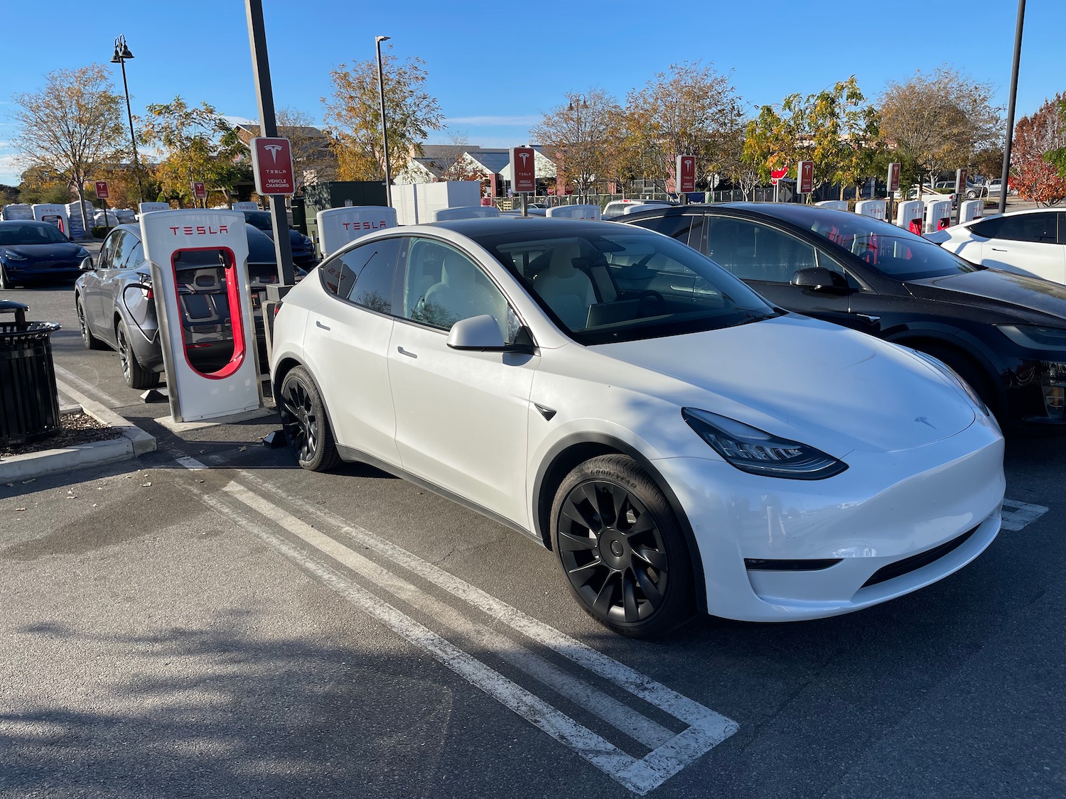 a white car parked at a charging station