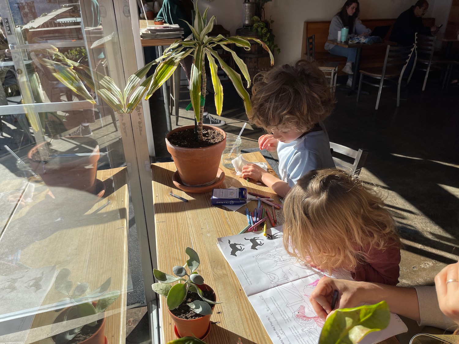 a group of children sitting at a table