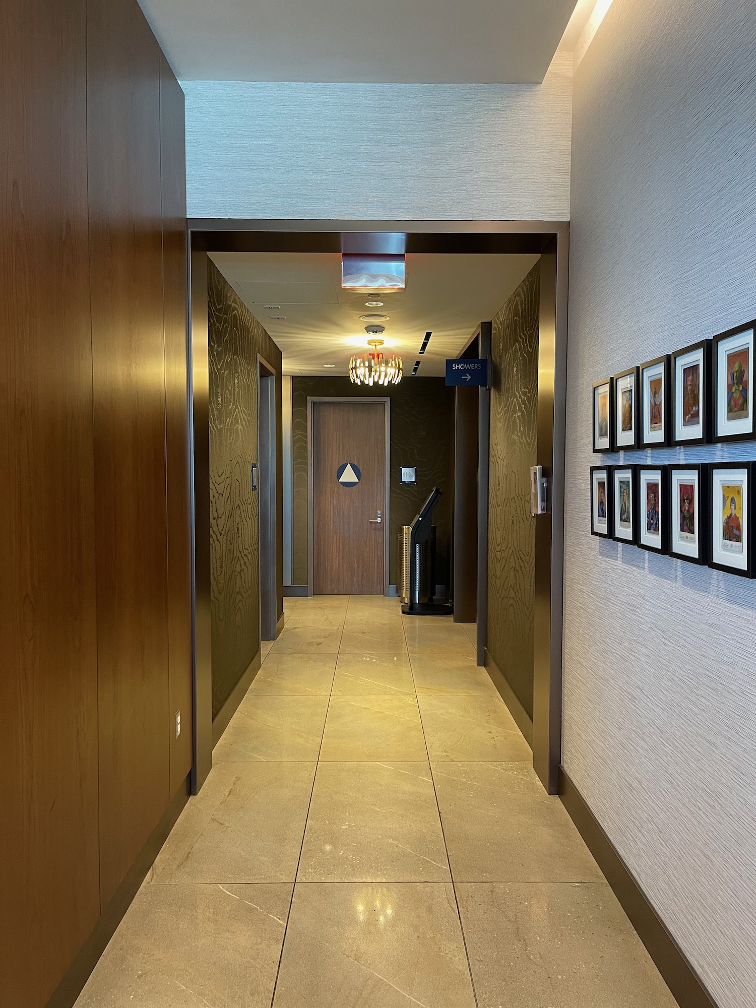 a hallway with pictures on the wall