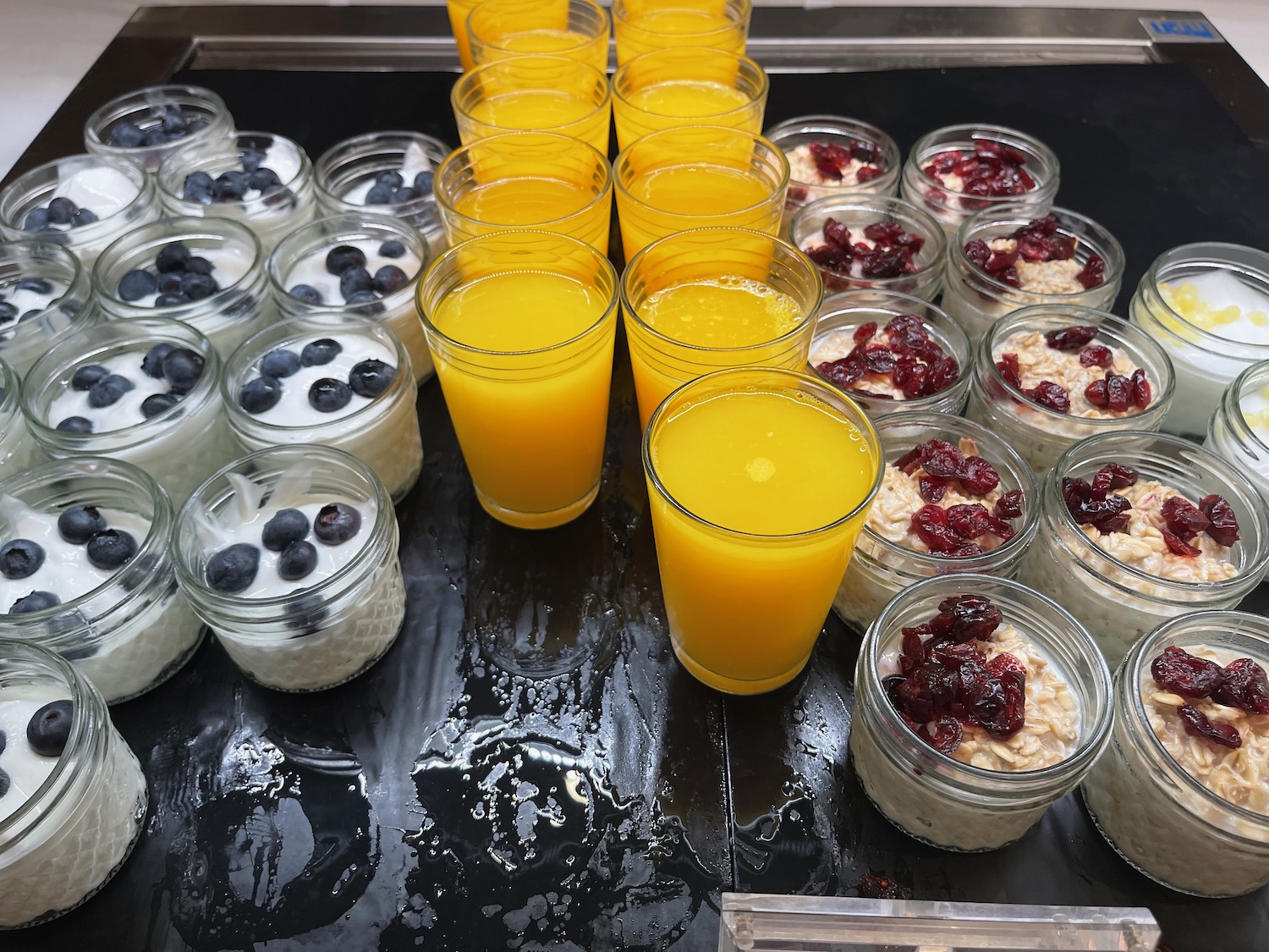 a group of glasses of fruit and yogurt