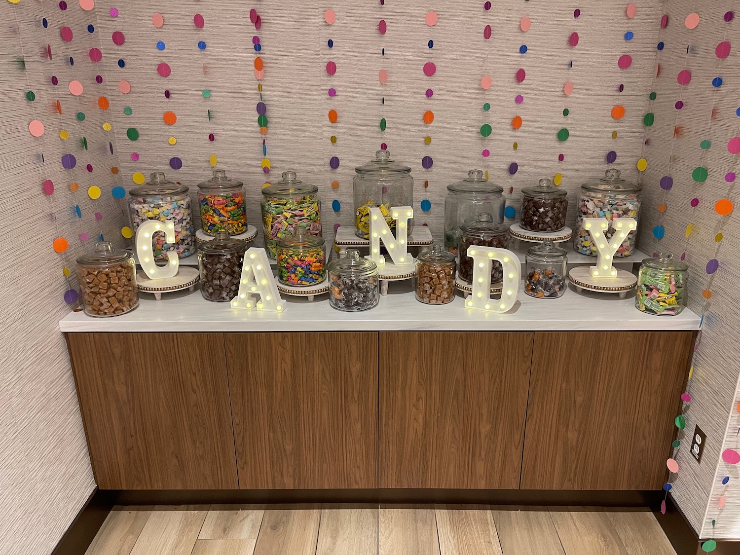a candy bar with a group of jars of food