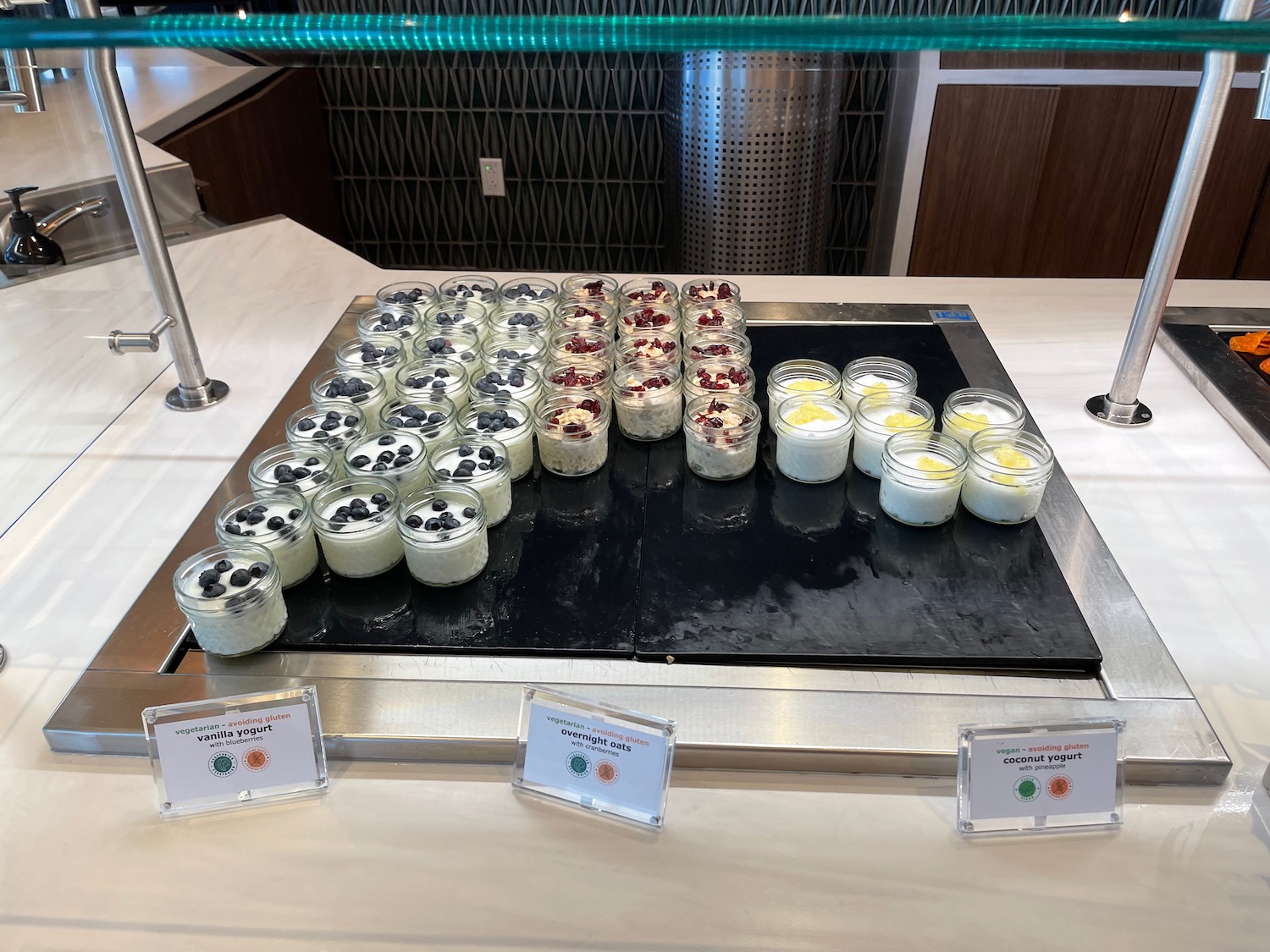 a group of jars of desserts on a table