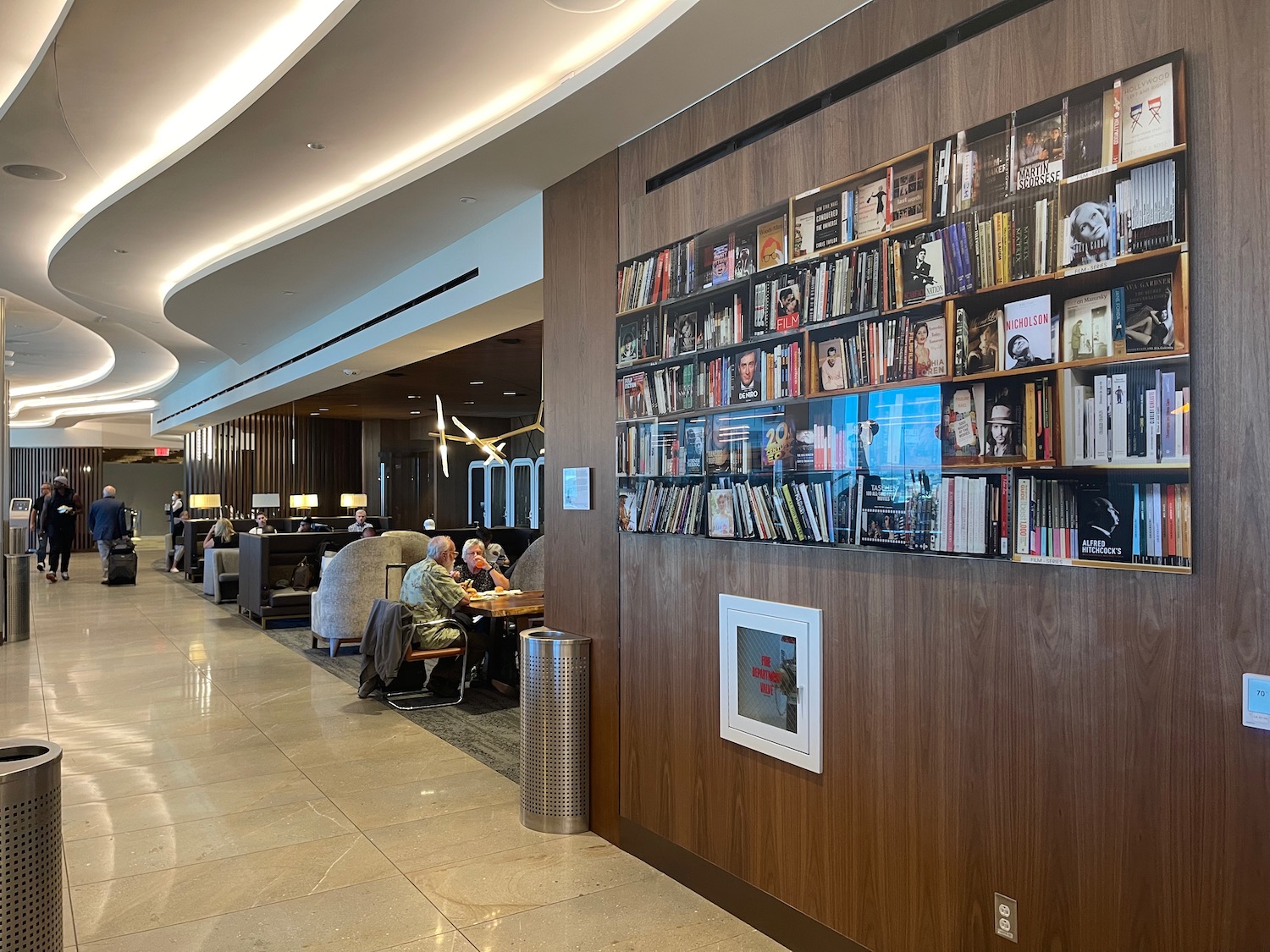 a library with books on the wall