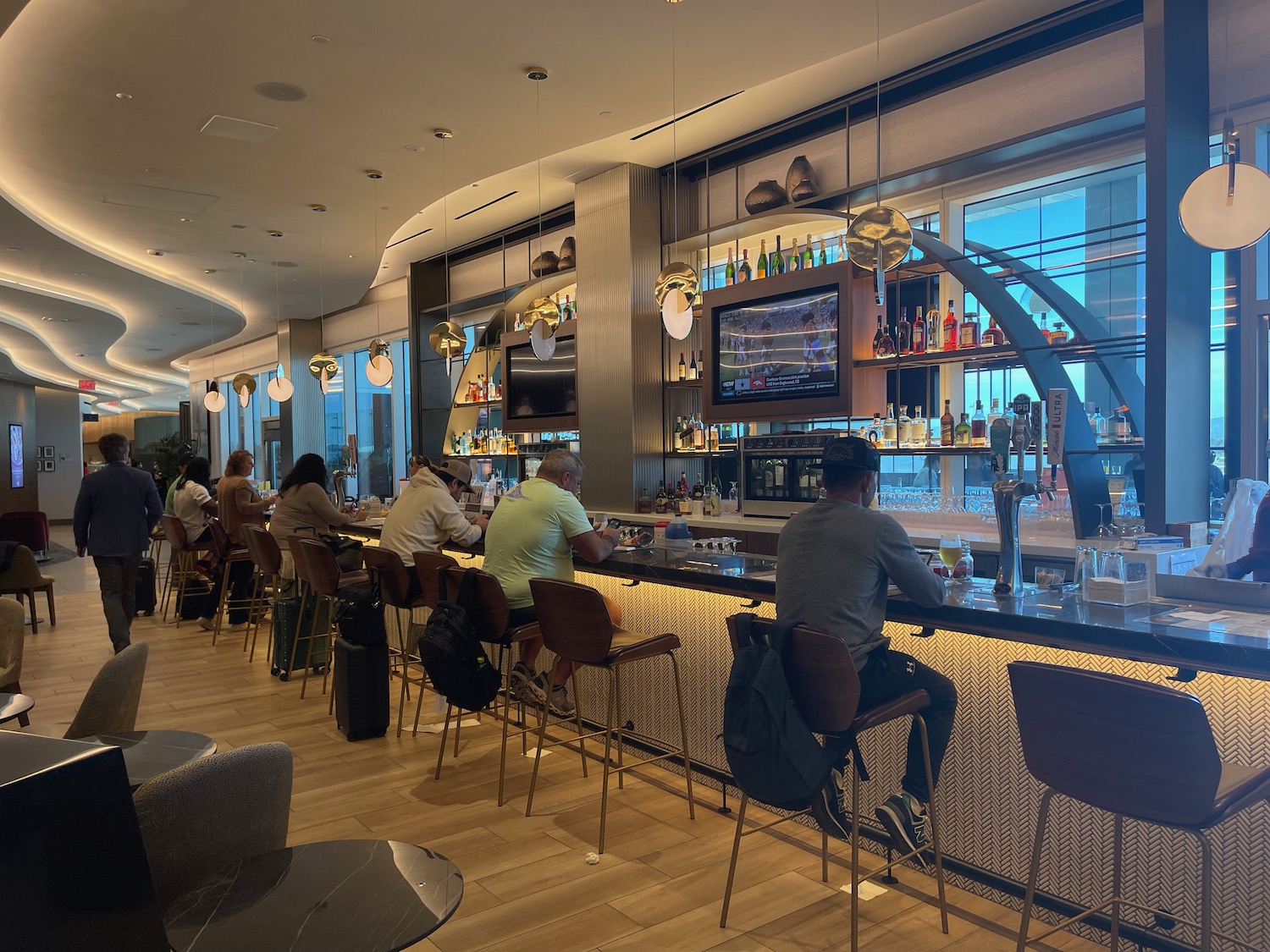 a group of people sitting at a bar