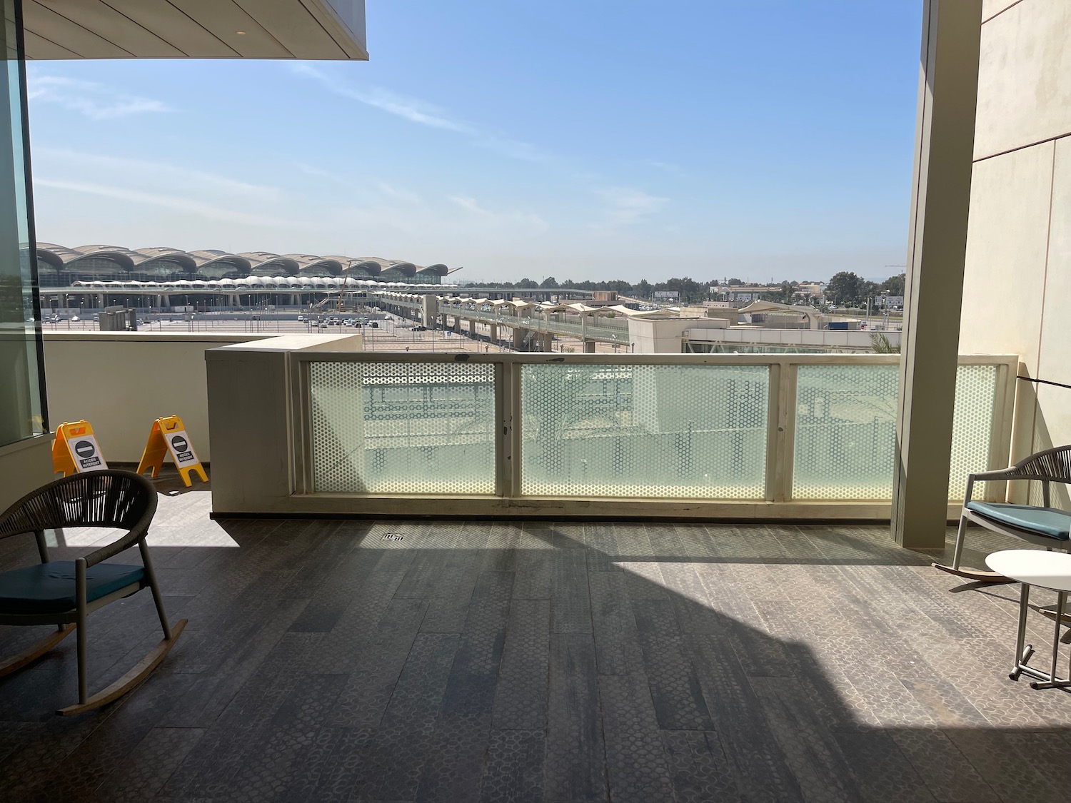 a balcony with a view of a city