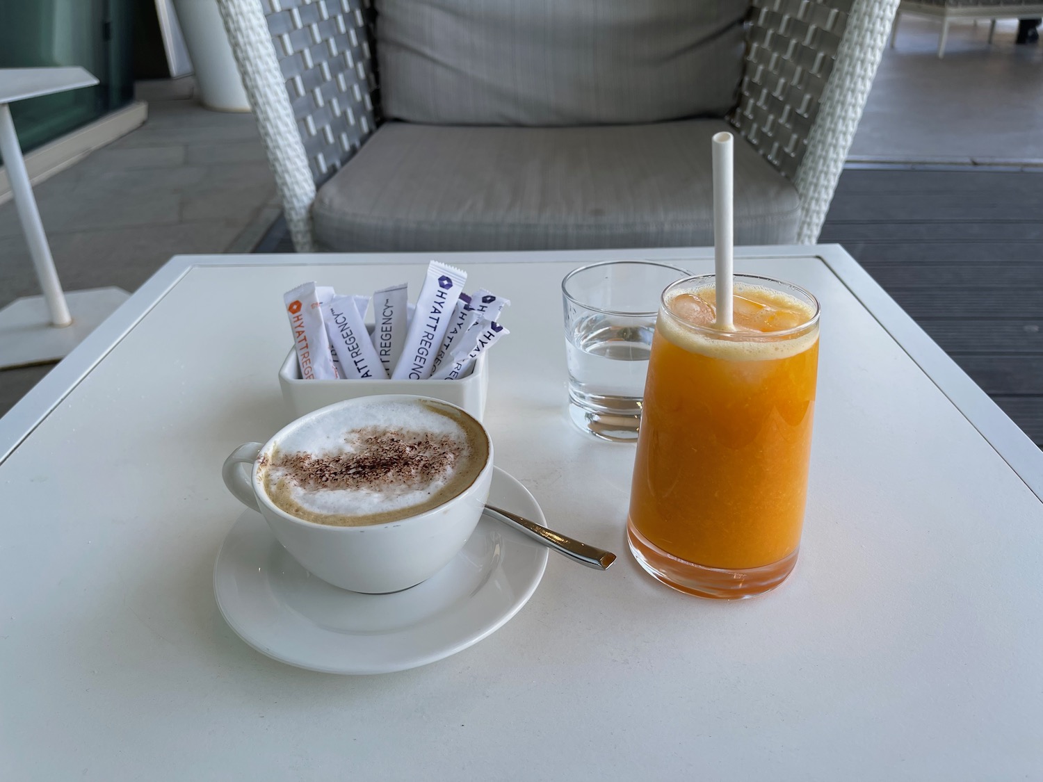 a cup of coffee and a drink on a table