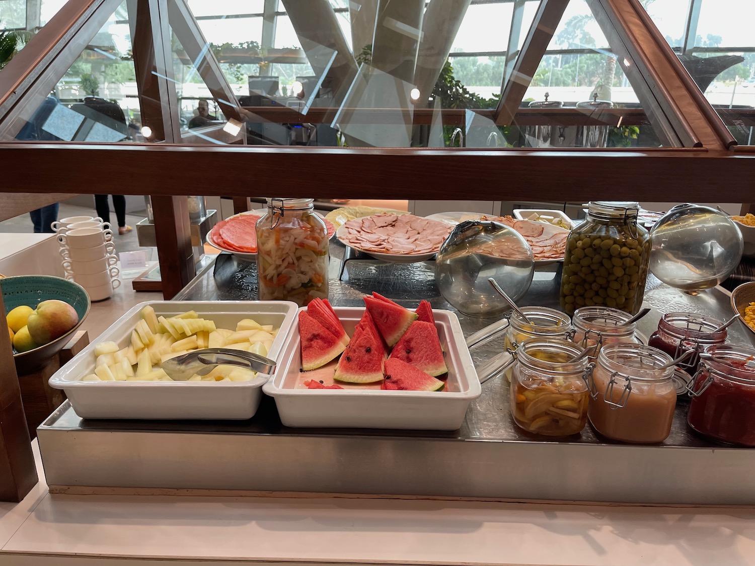 a buffet table with food in containers