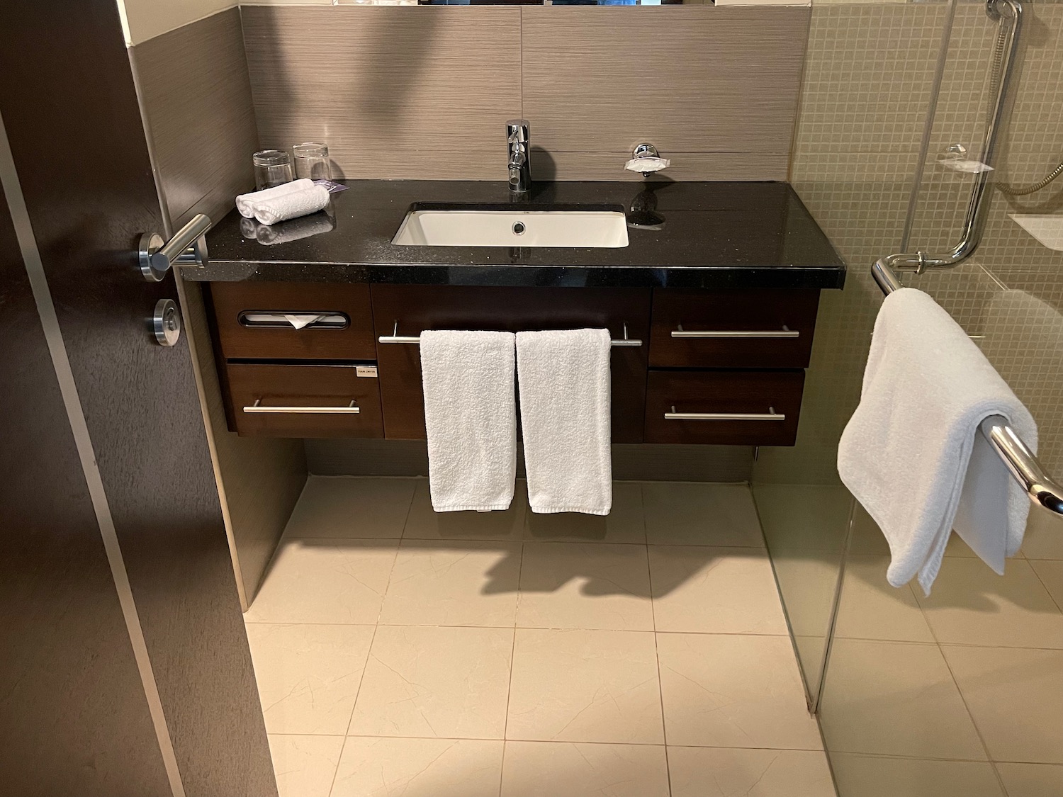 a bathroom with a sink and towels