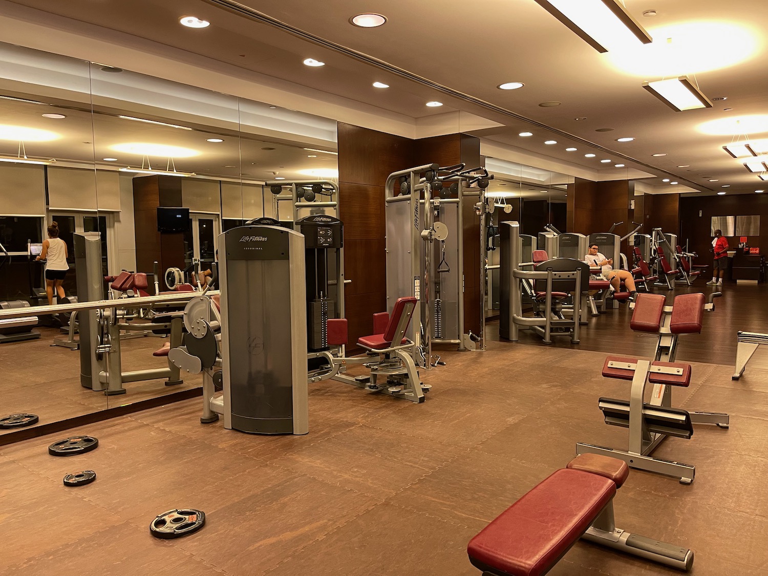 a gym with several exercise equipment