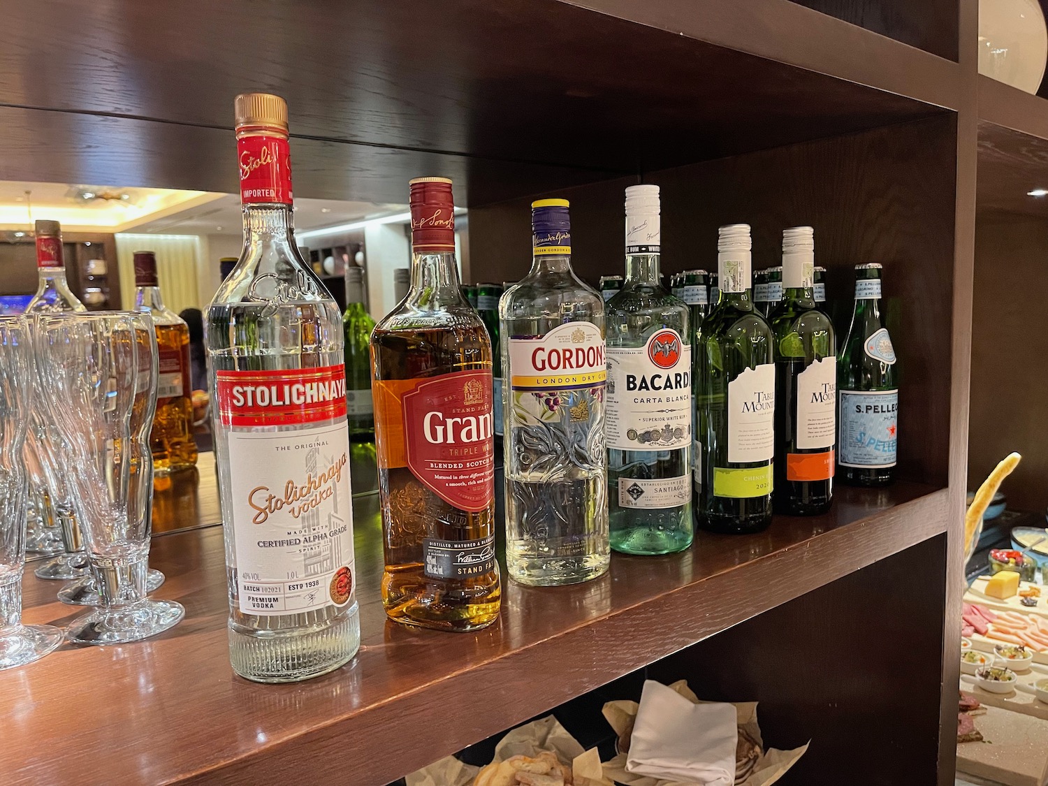 a group of bottles of alcohol on a shelf