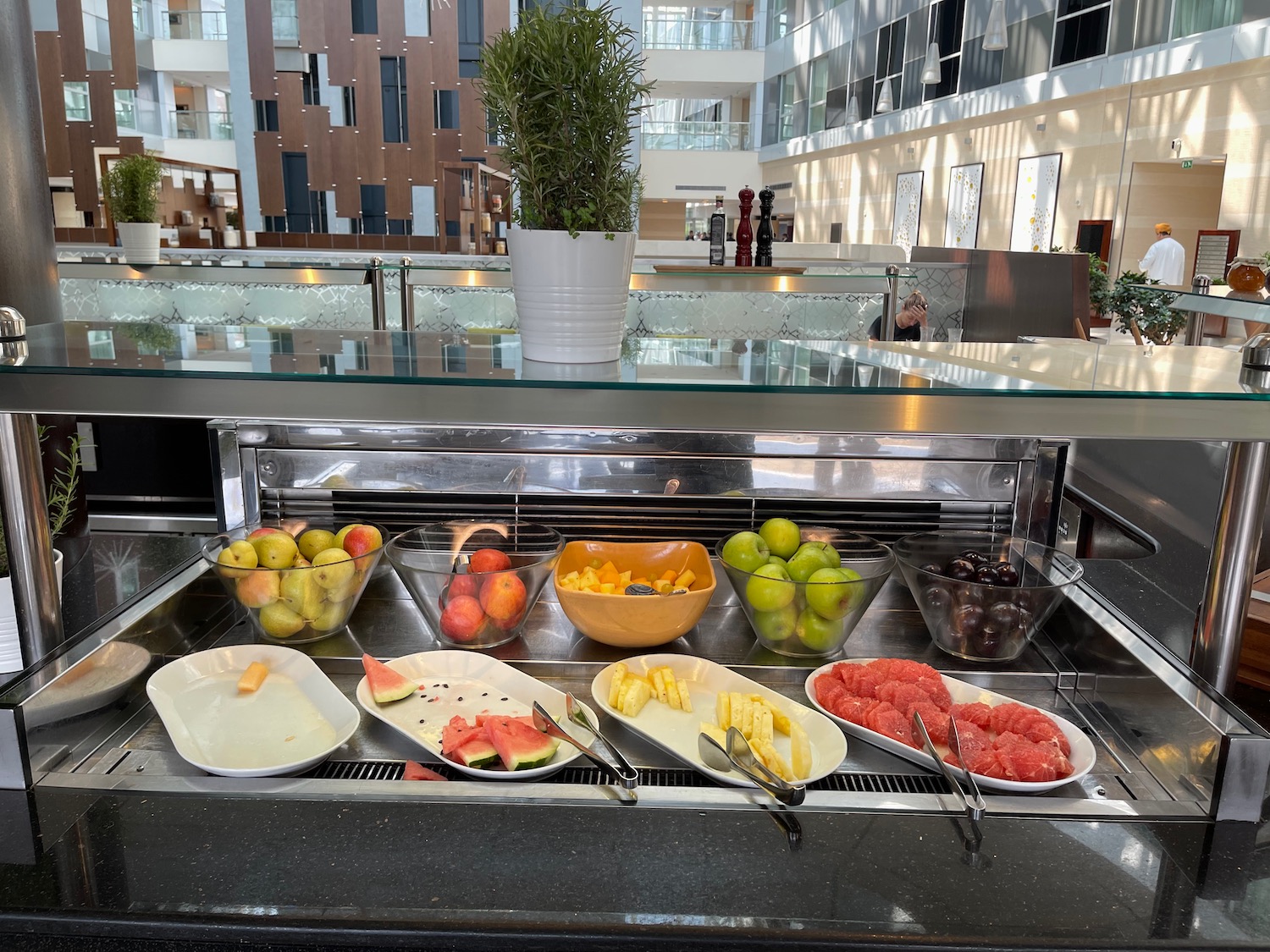 a buffet with fruit and vegetables