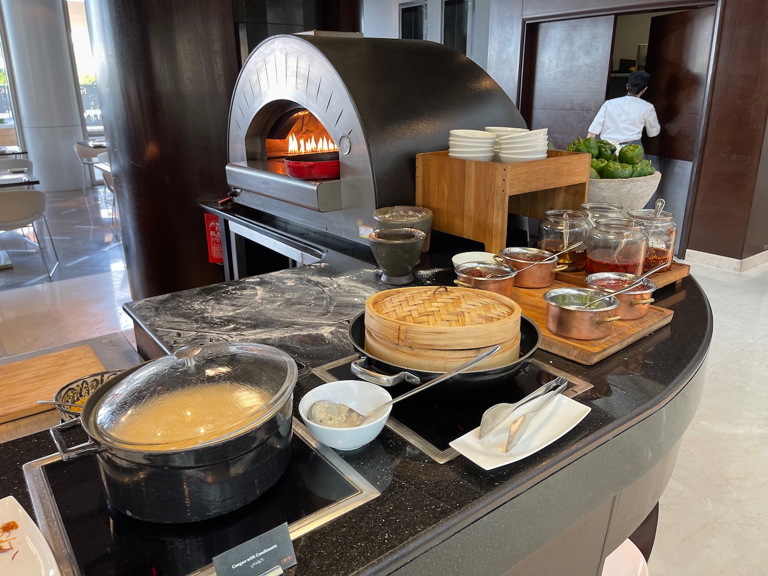 a kitchen with a wood oven and food items