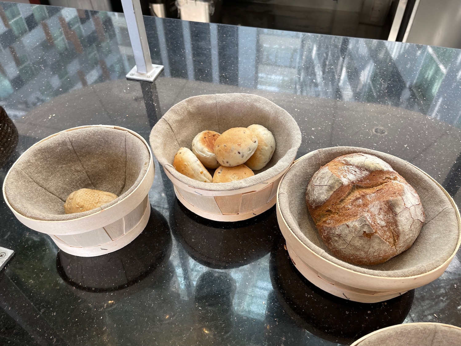 a group of bread in baskets