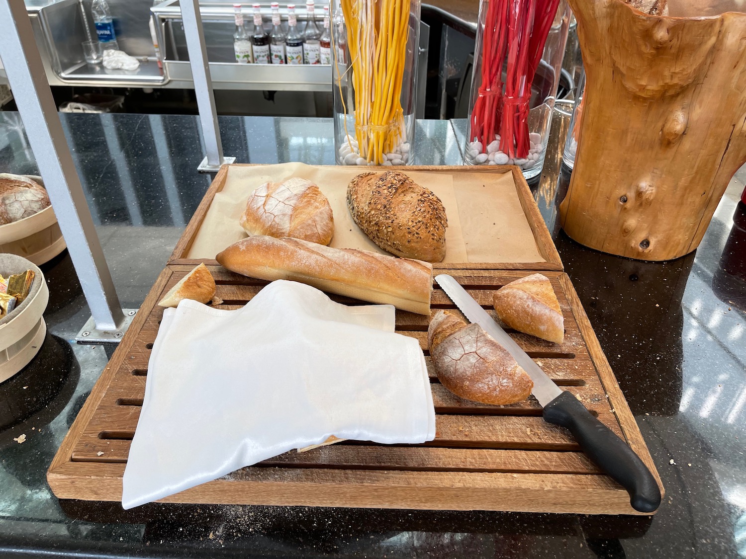 a cutting board with bread and a knife on it