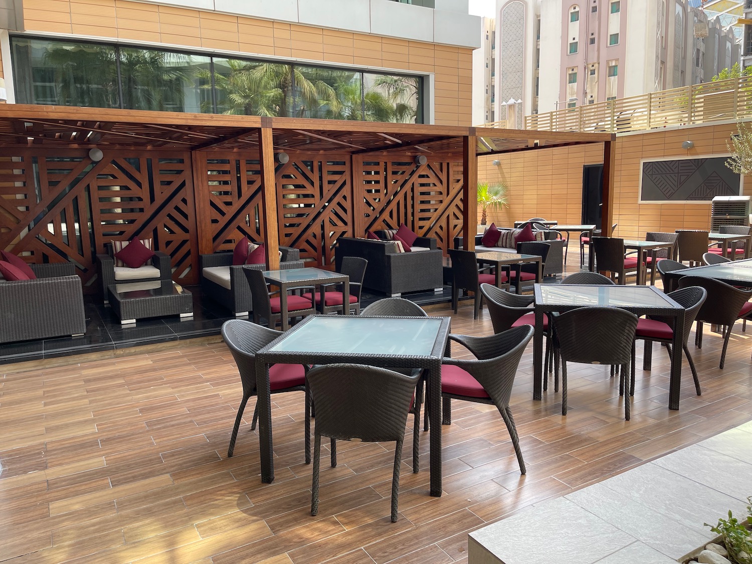 a patio with tables and chairs