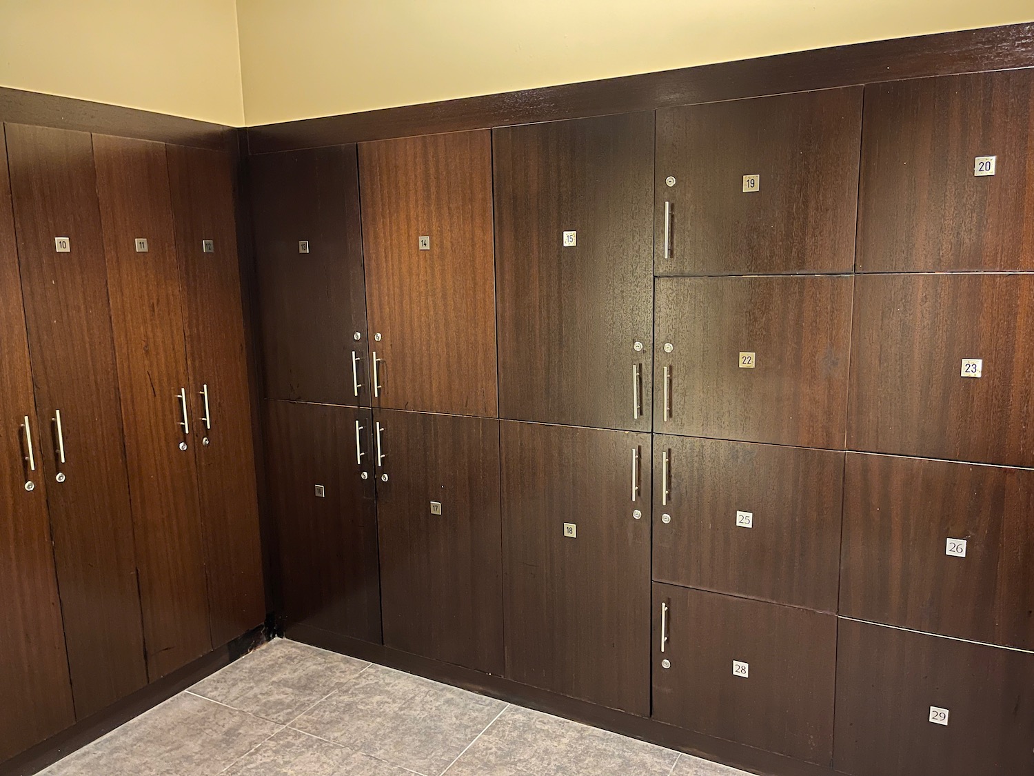 a room with many wooden cabinets