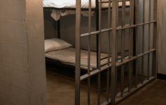 a bunk bed in a jail cell