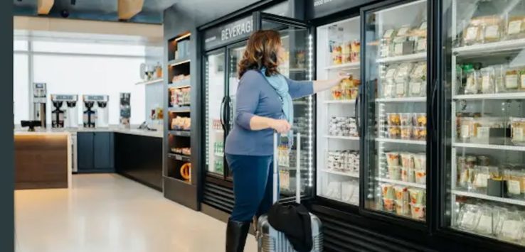 a woman pushing a luggage in a store