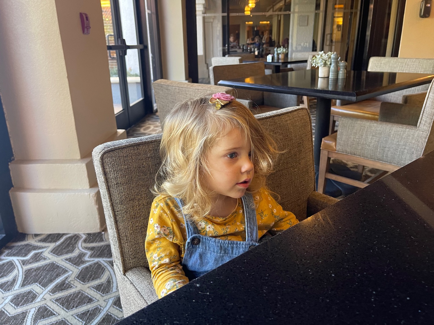 a girl sitting at a table