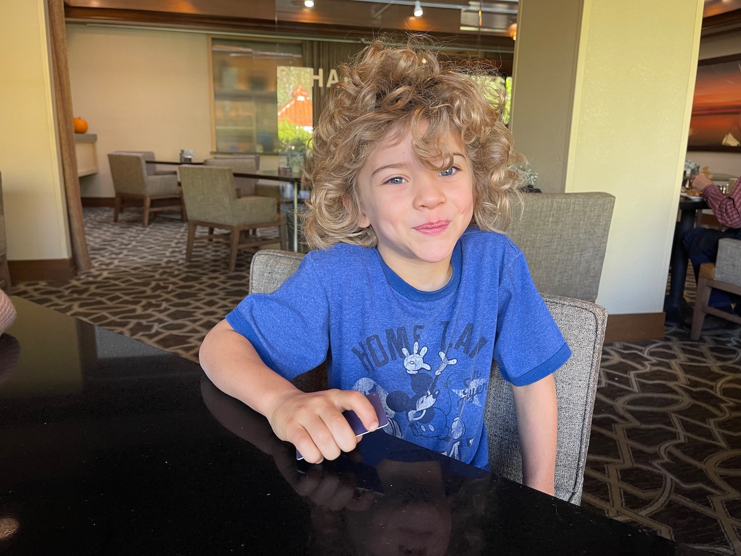 a boy sitting at a table