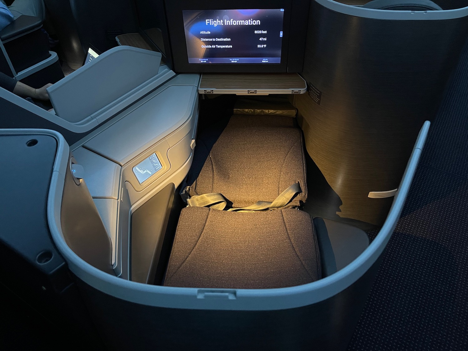 a seat in a seat with a screen in the back