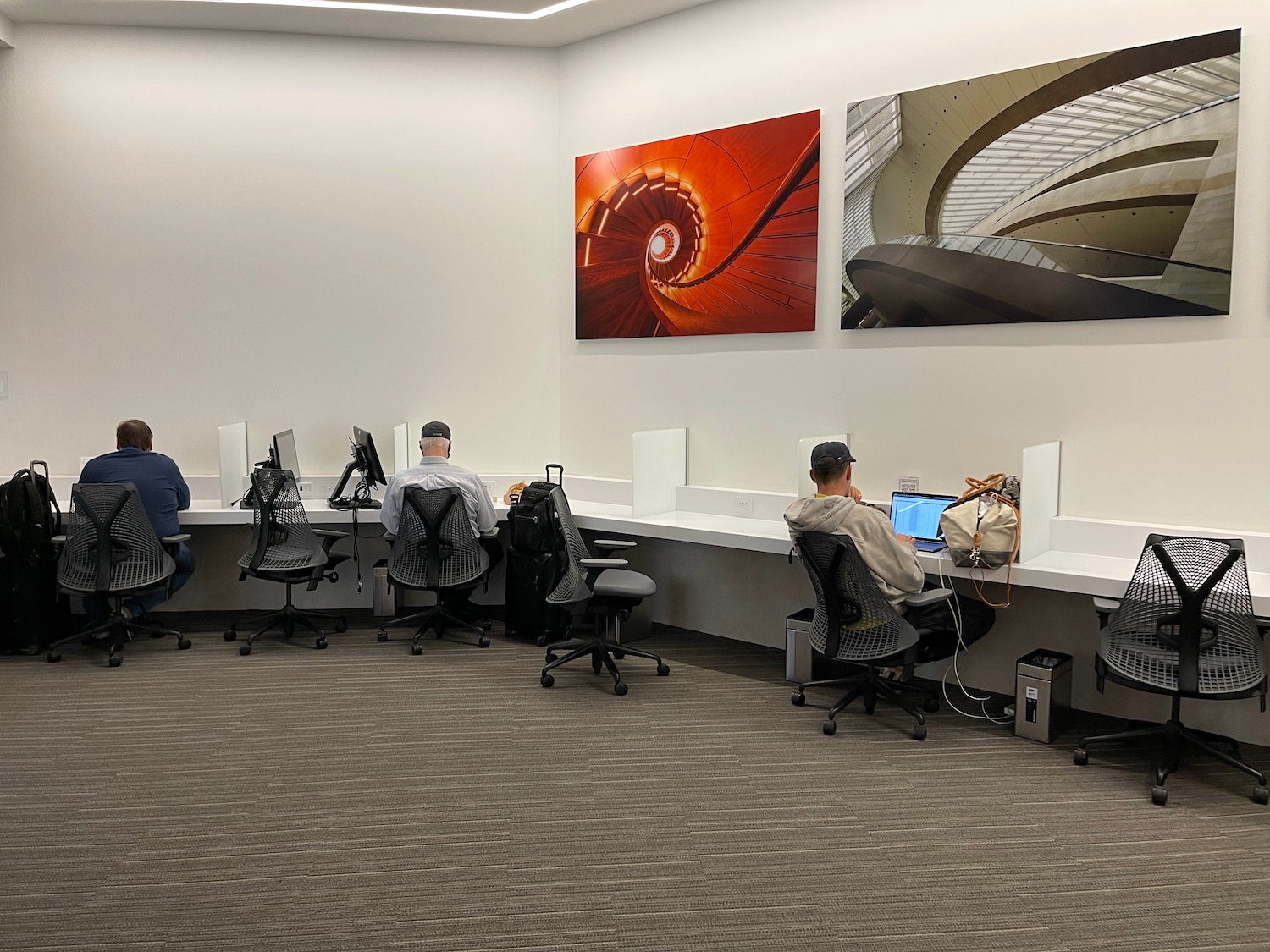 a group of people sitting at computers