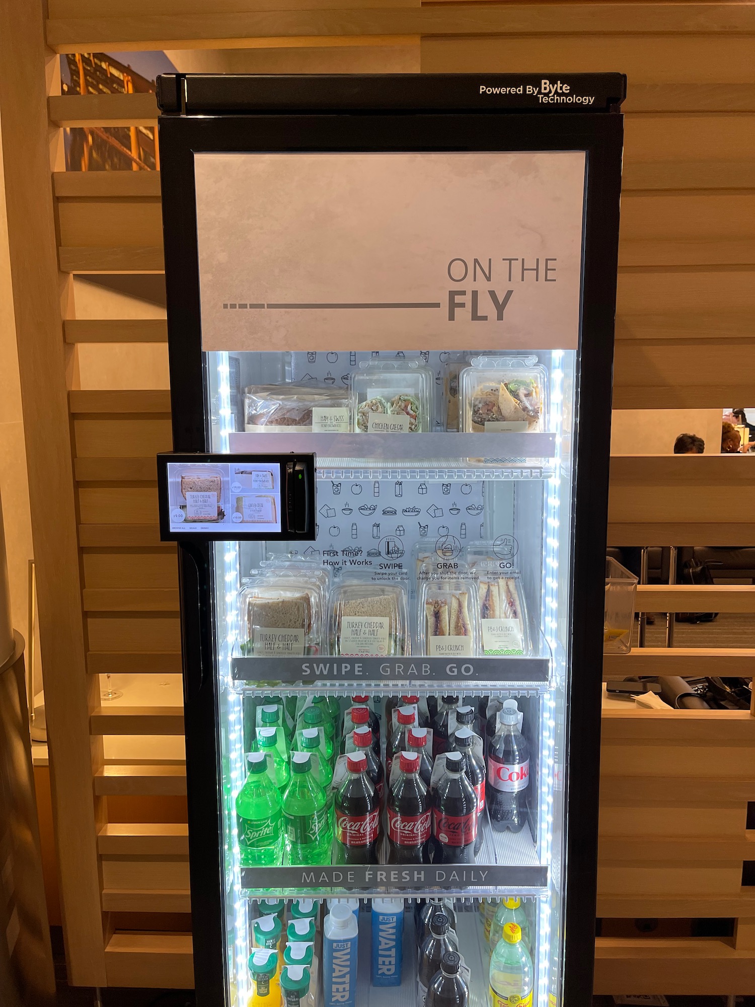 a display case with drinks and beverages