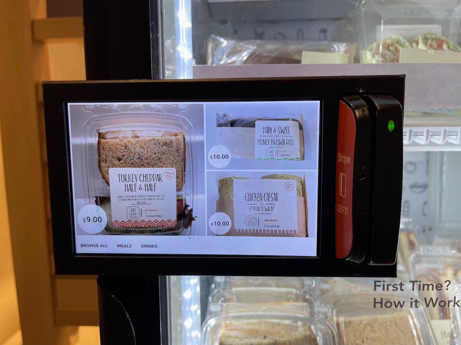 a machine with a screen and a picture of food