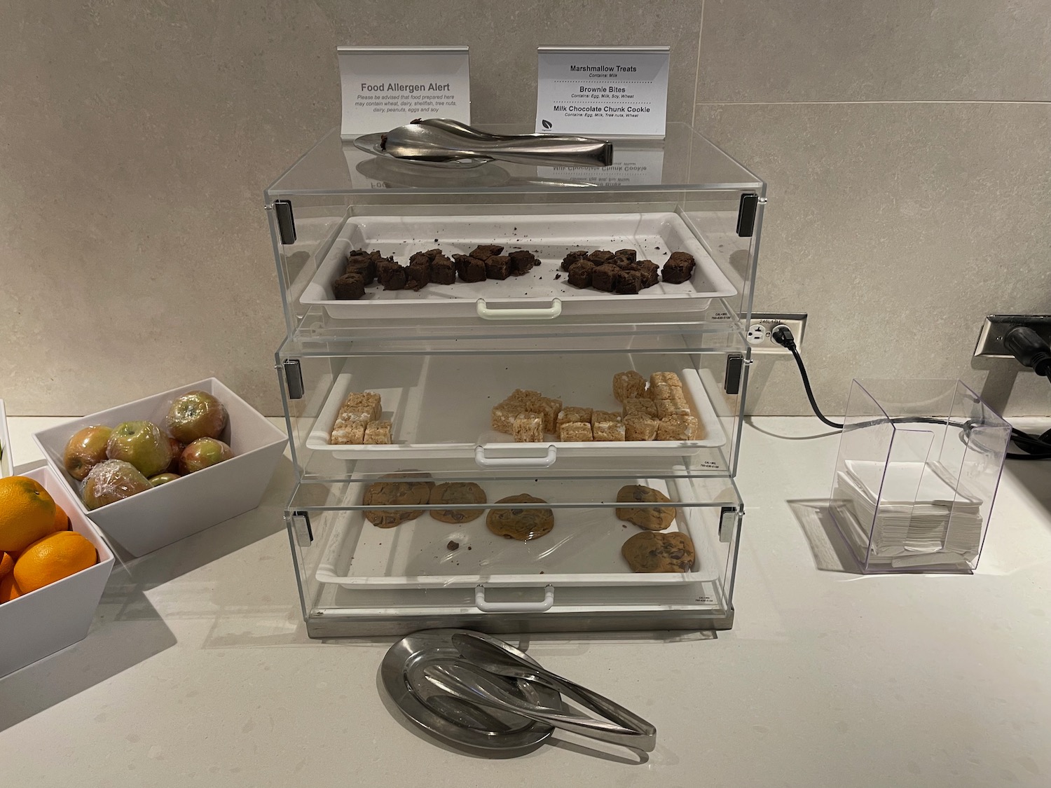 a tray of cookies and a spoon on a counter