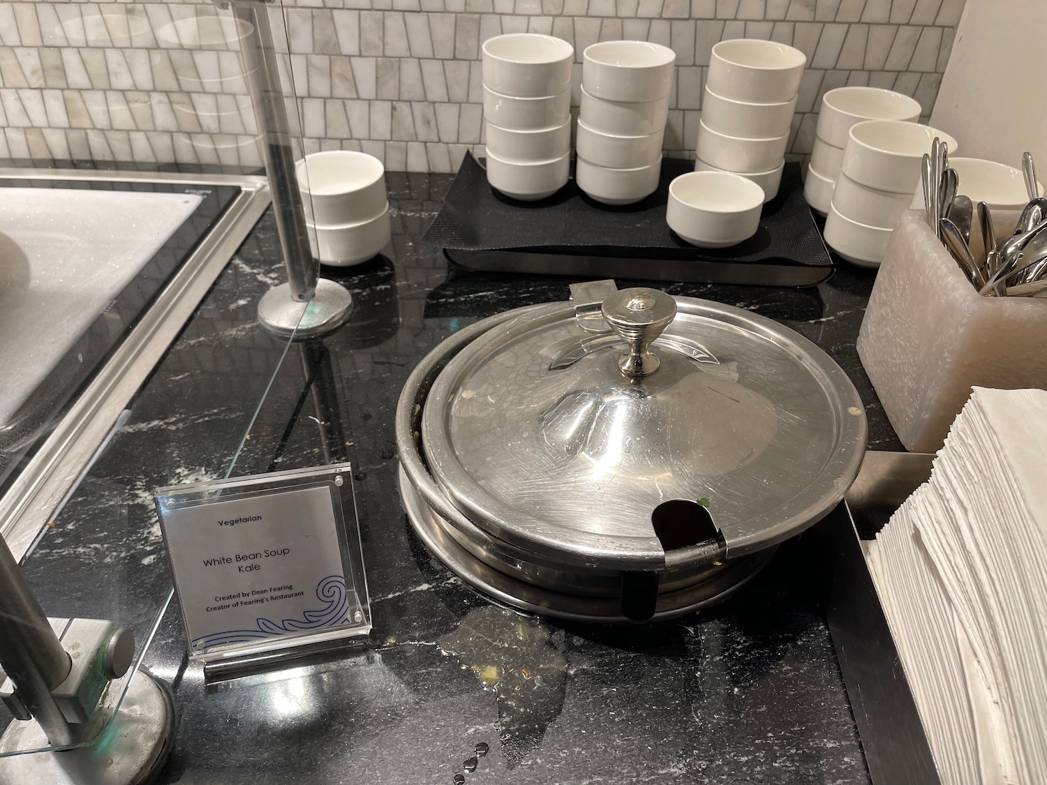 a group of white cups on a counter