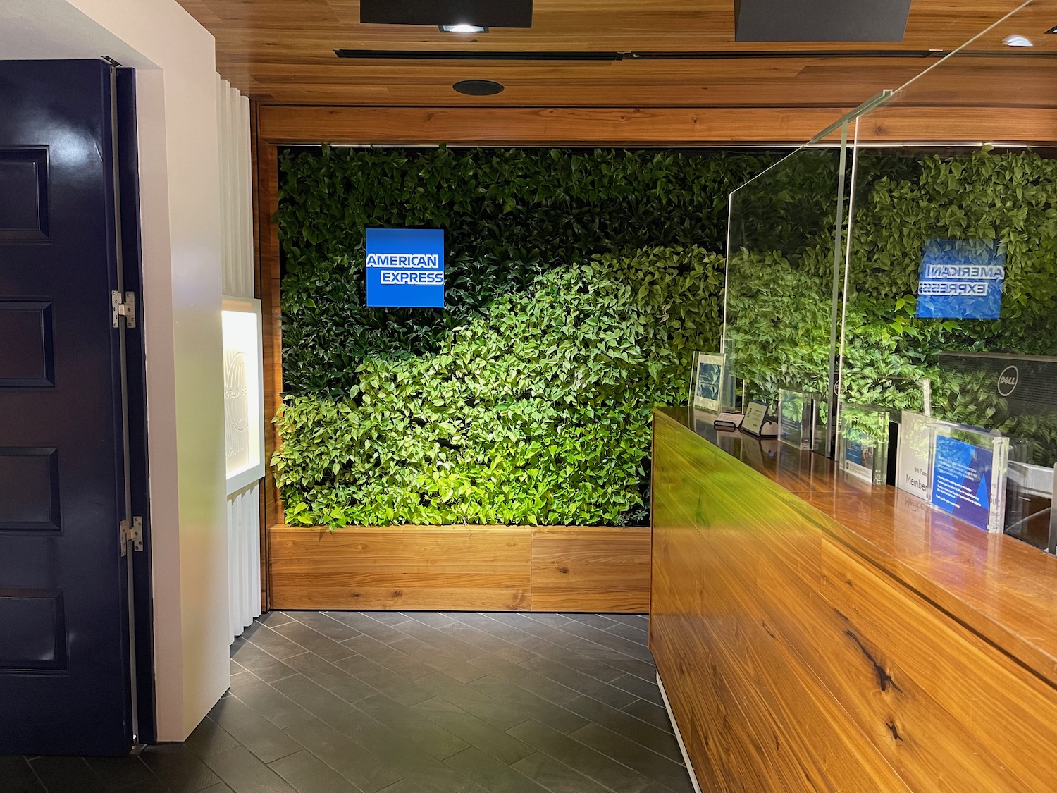 a green wall with a glass case