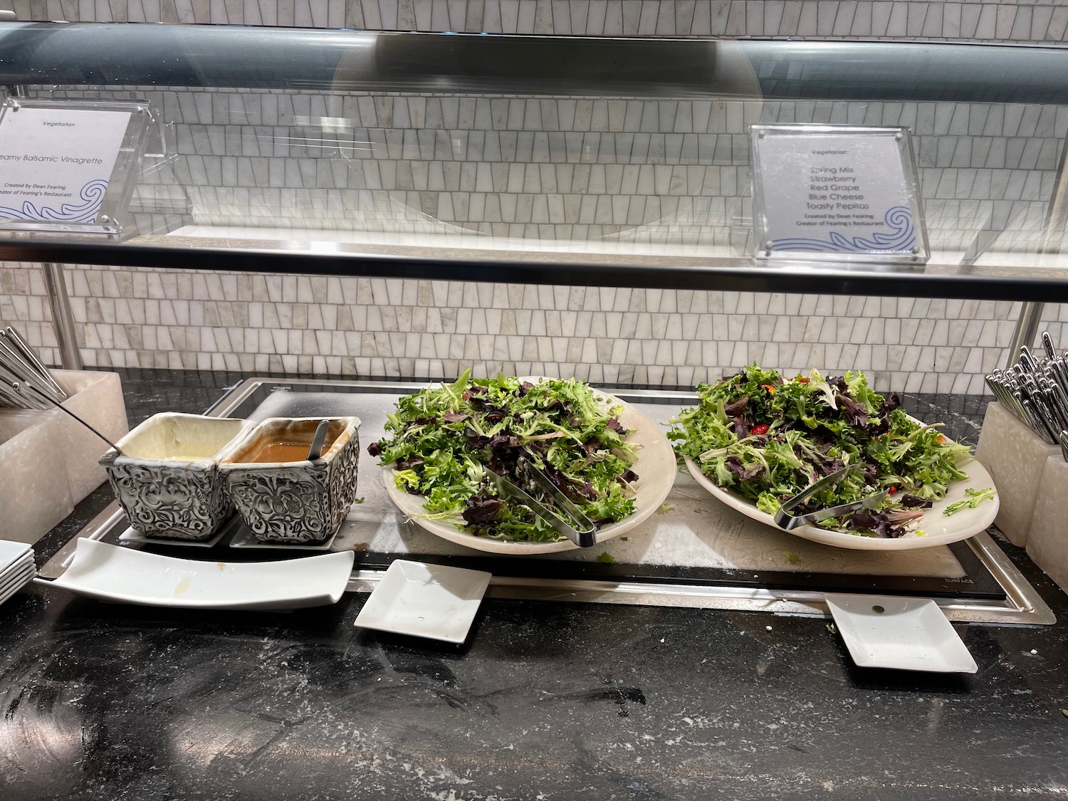 a salad on plates on a counter