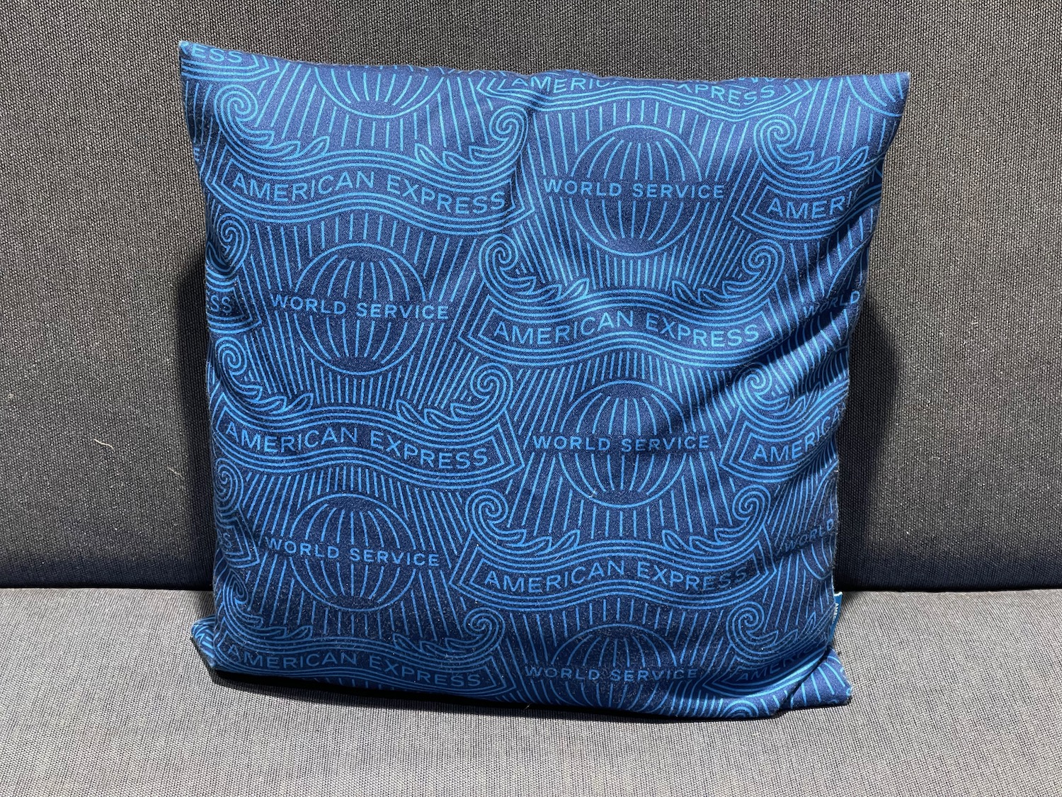 a blue pillow on a couch