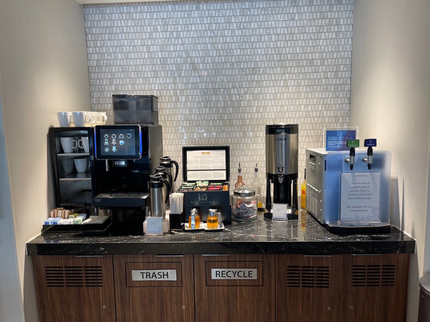 a coffee machine and coffee maker on a counter