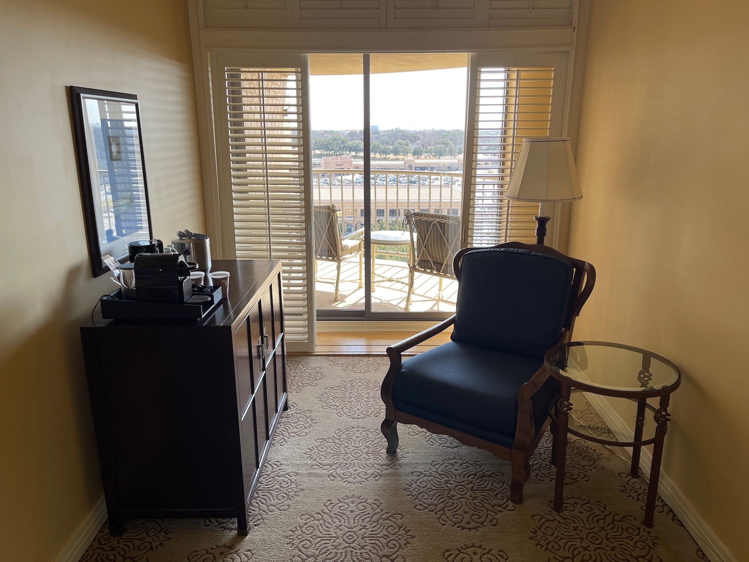 a room with a chair and a dresser