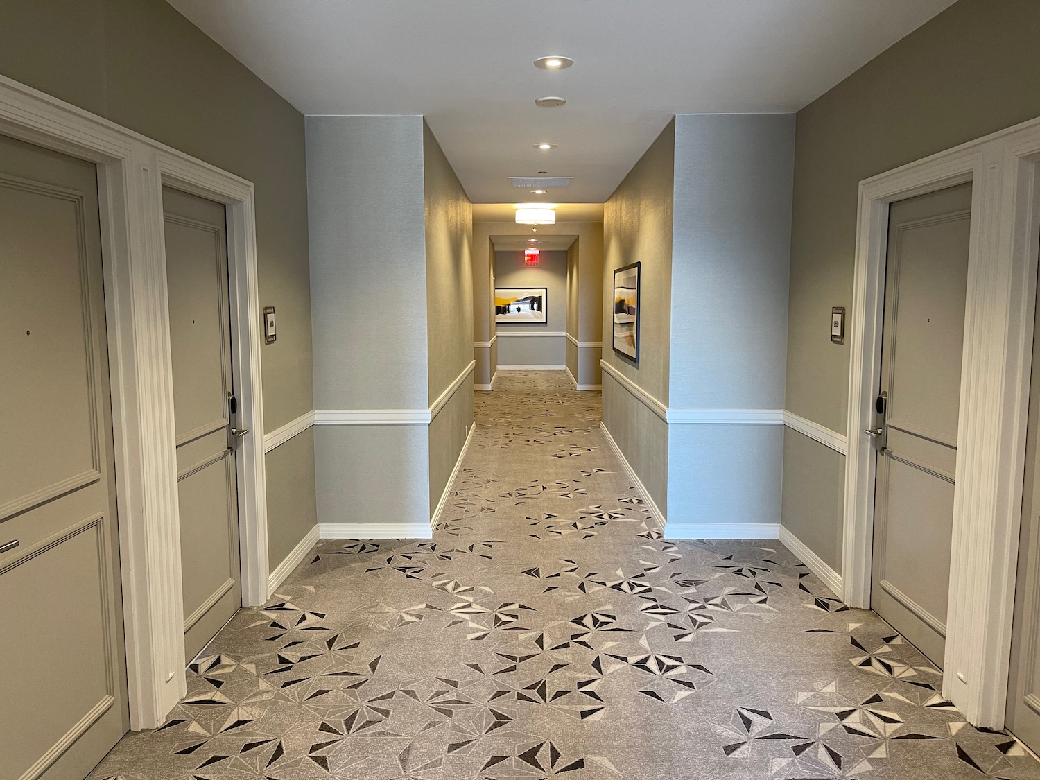 a hallway with a patterned floor