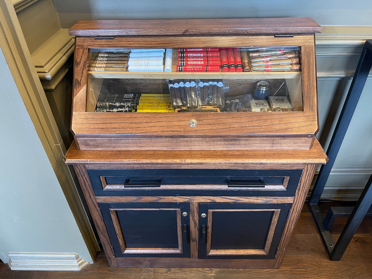 a wooden cabinet with a glass top