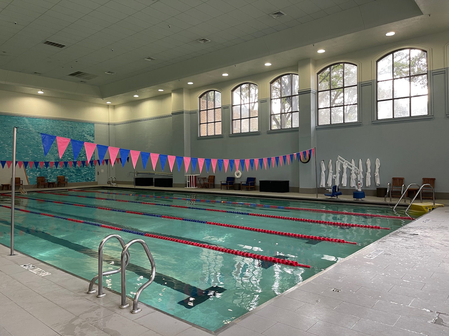 a swimming pool with flags