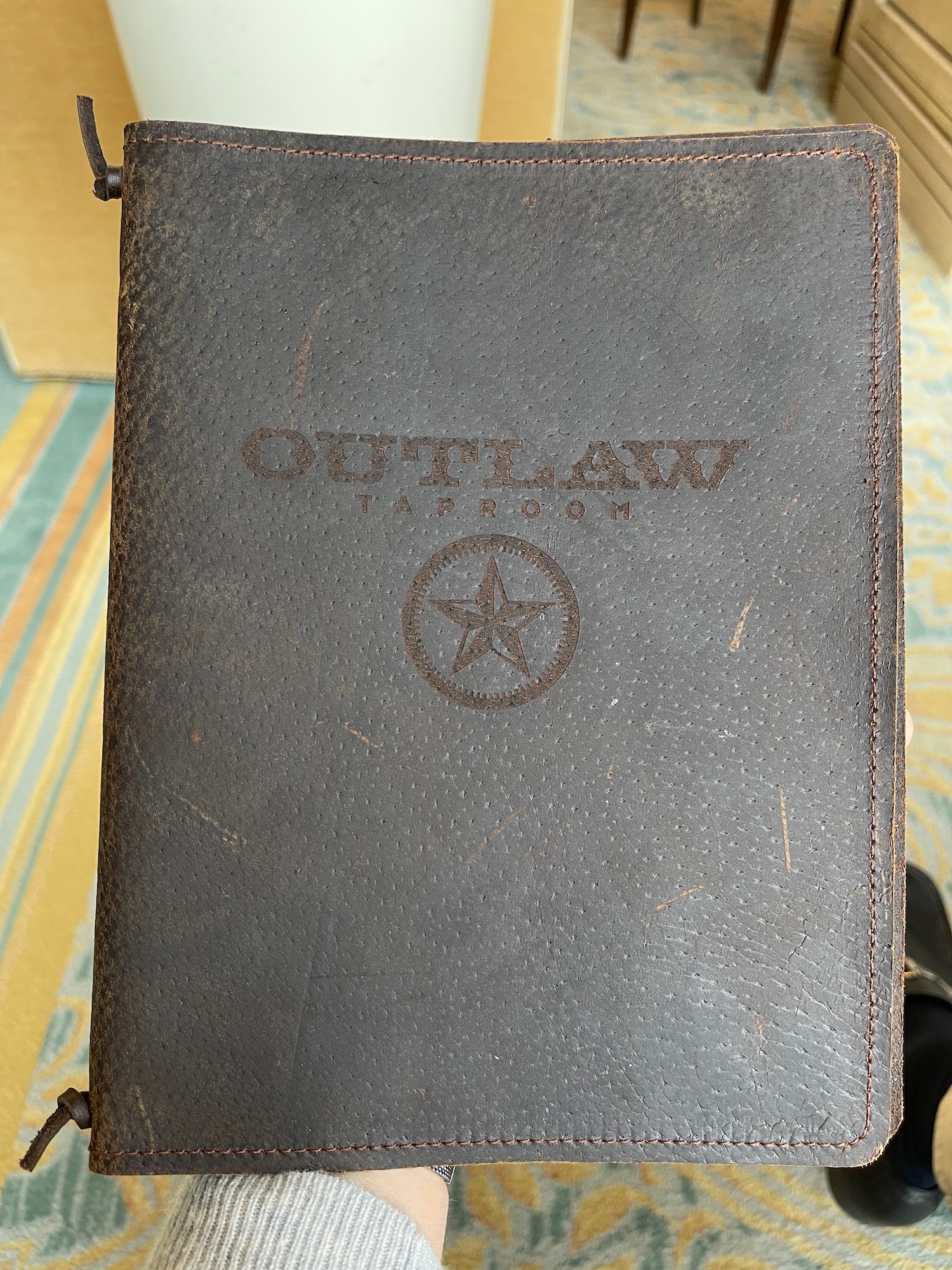a leather book with a star on it