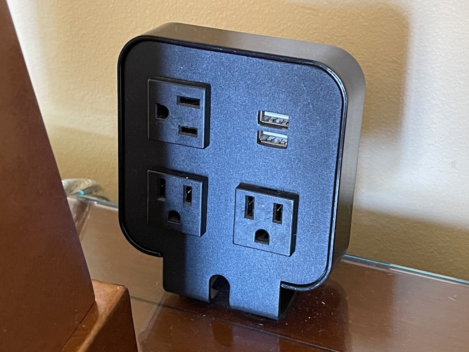 a black electrical outlet with multiple ports