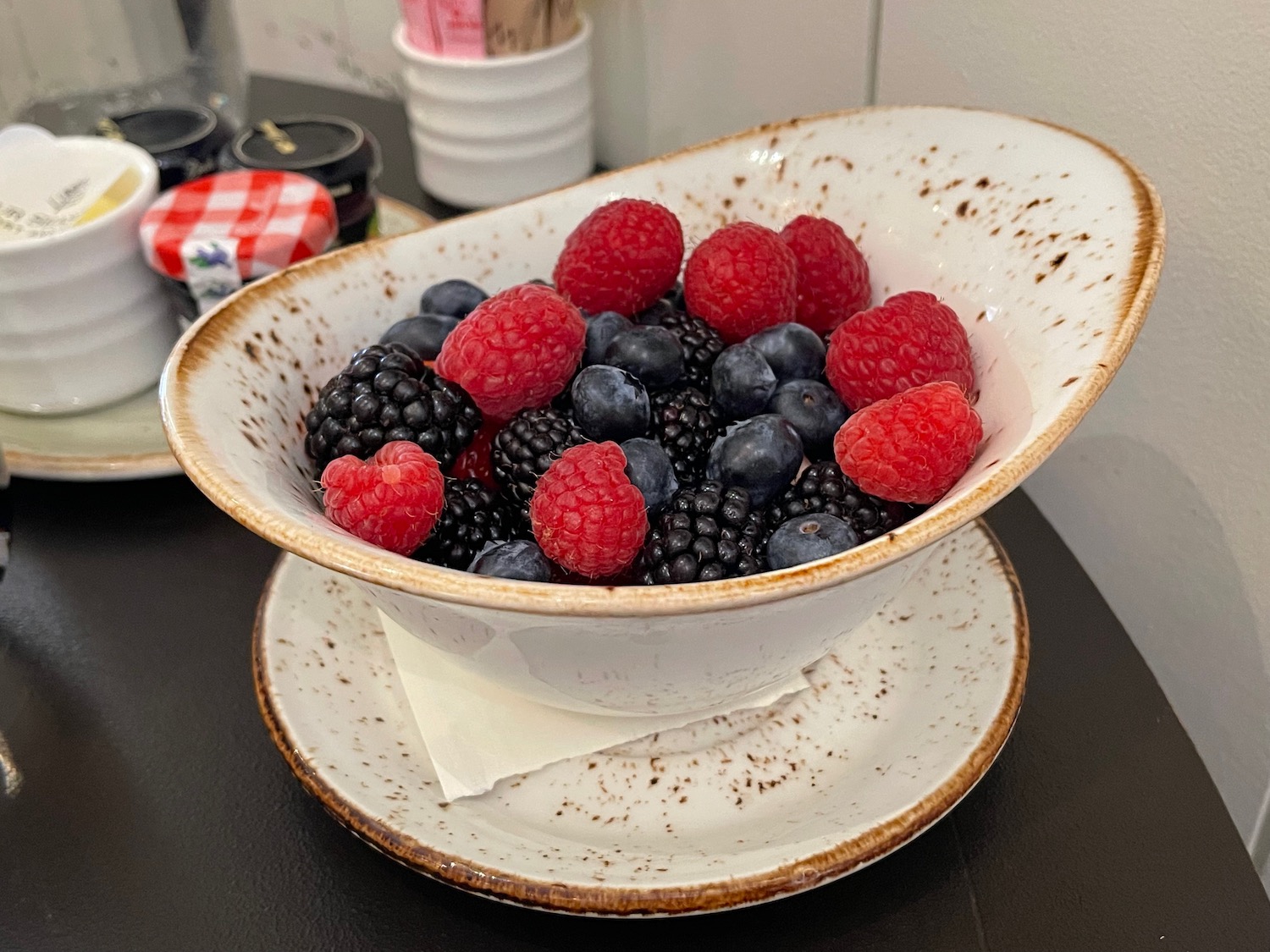 a bowl of berries on a plate