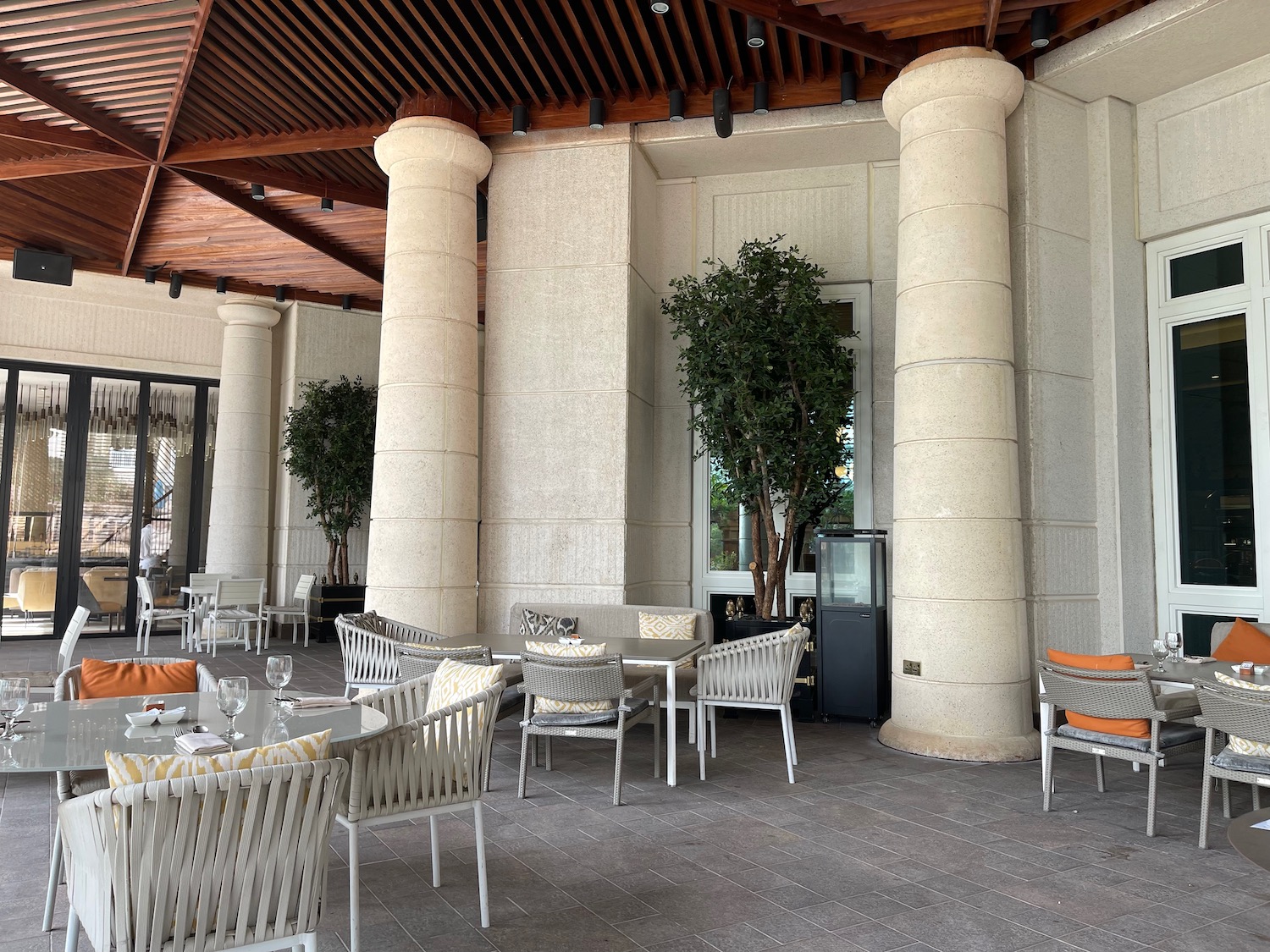 a patio with tables and chairs