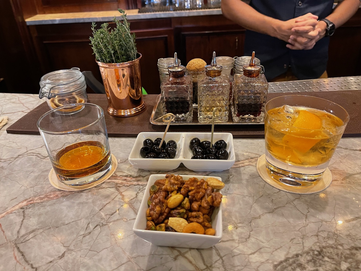 a table with different drinks and snacks