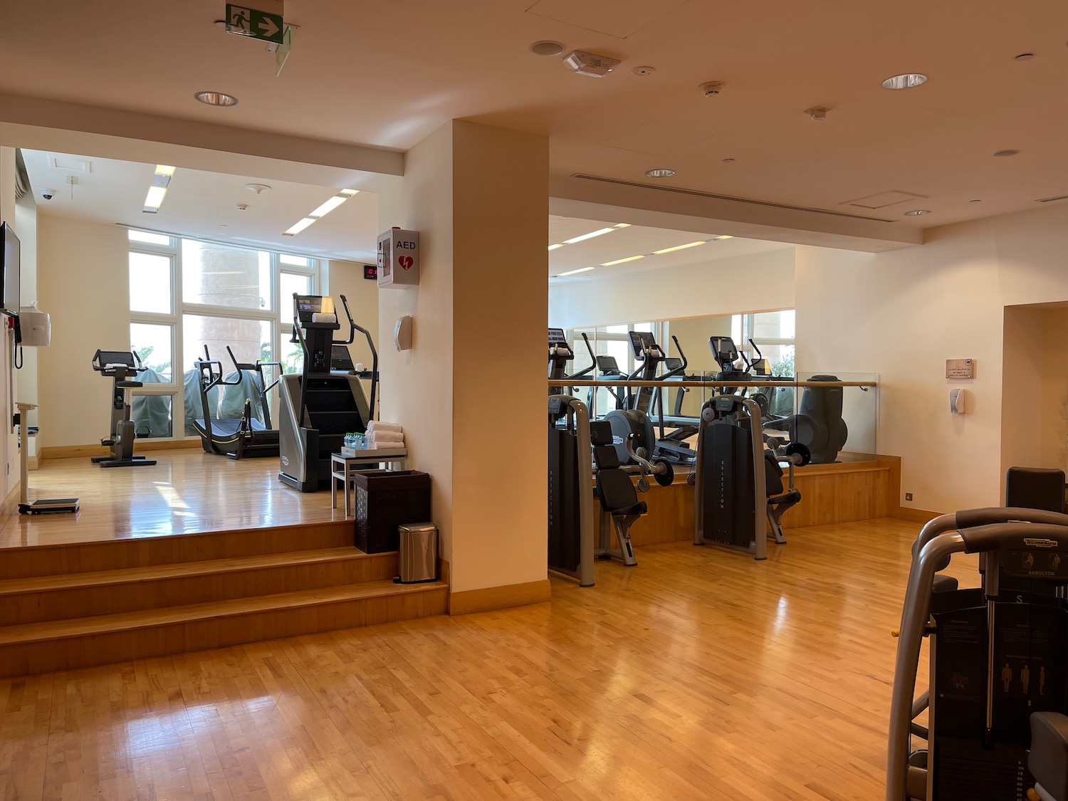 a gym with treadmills and stairs