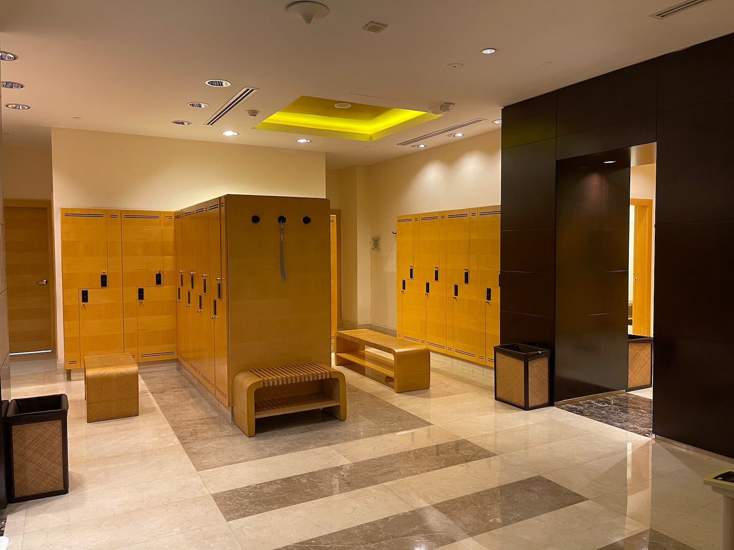 a locker room with a bench and lockers