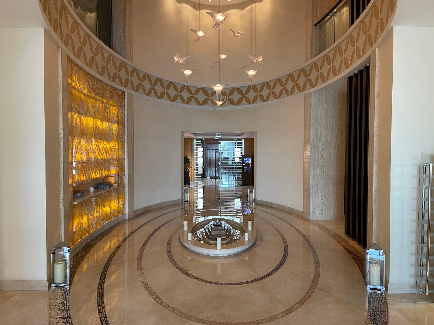 a circular hallway with a glass display